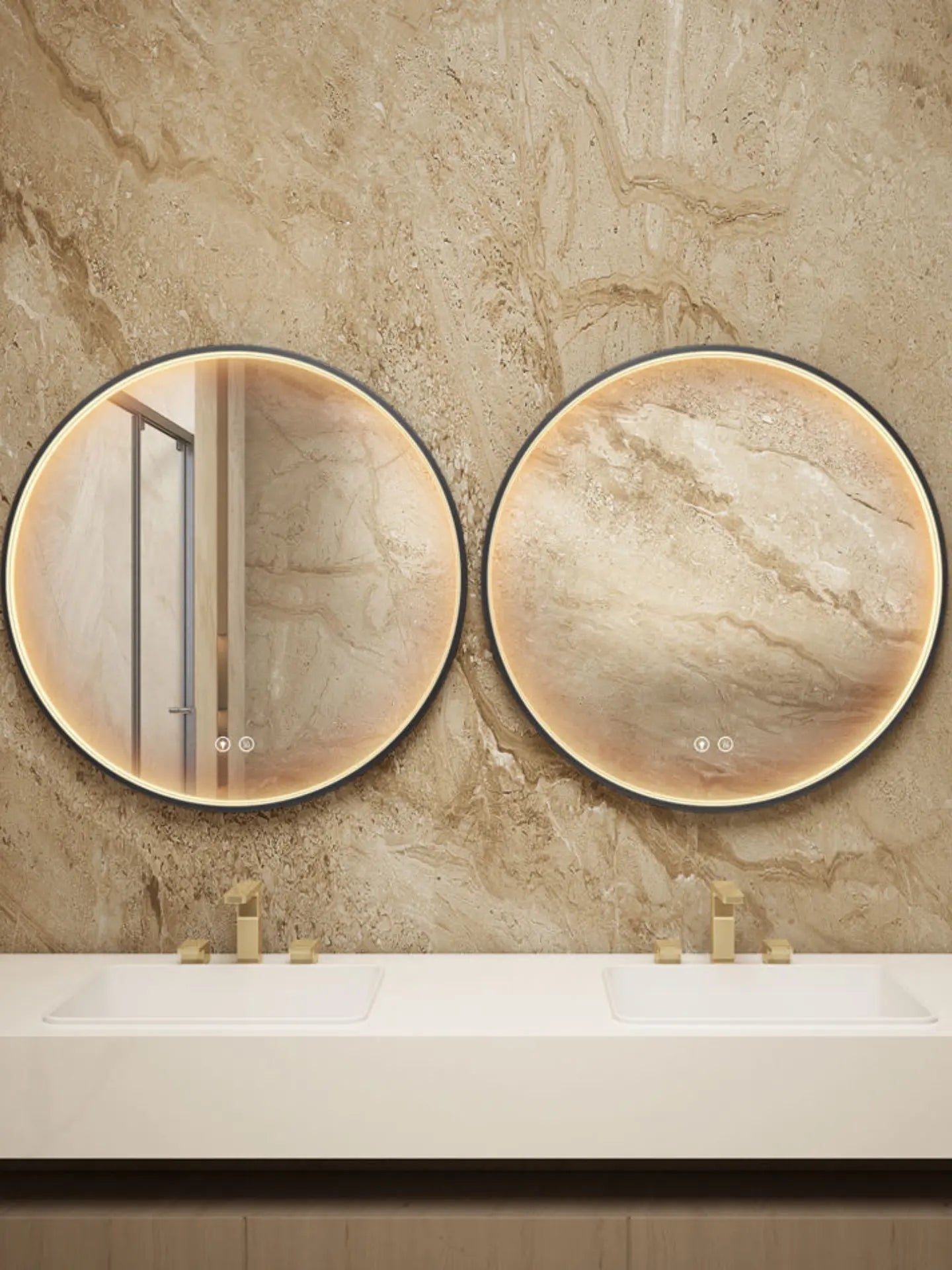 Two round mirrors on a marble wall above a bathroom vanity.