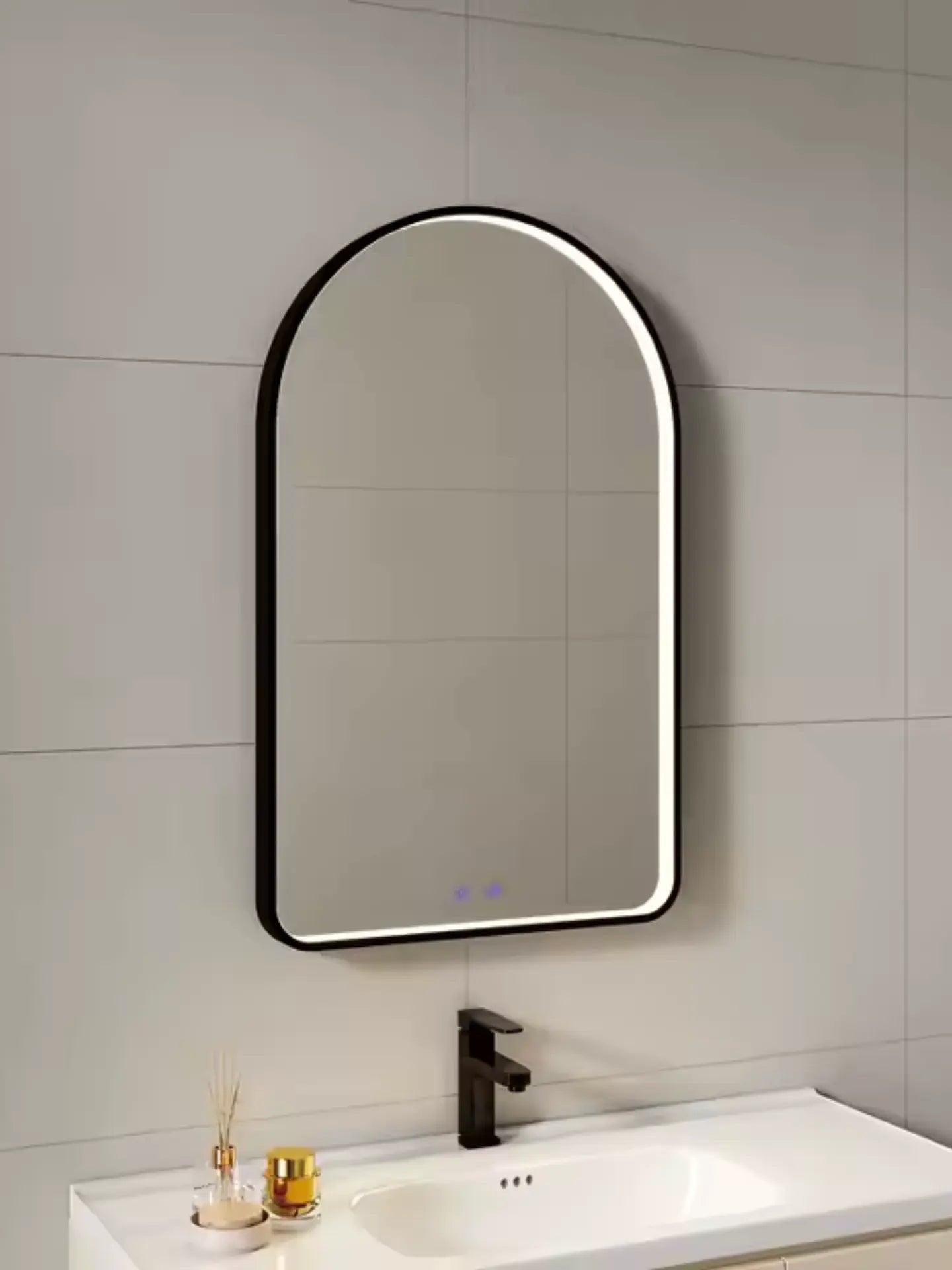 Bathroom with a modern half round mirror and sink.