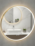 Round illuminated bathroom mirror with a sink and decorative elements on a marble wall.