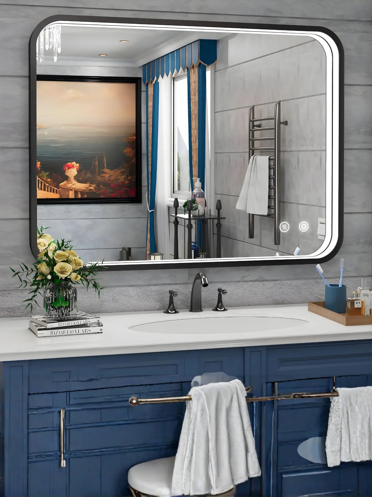 Bathroom vanity with large mirror, blue cabinets, and decorative elements.