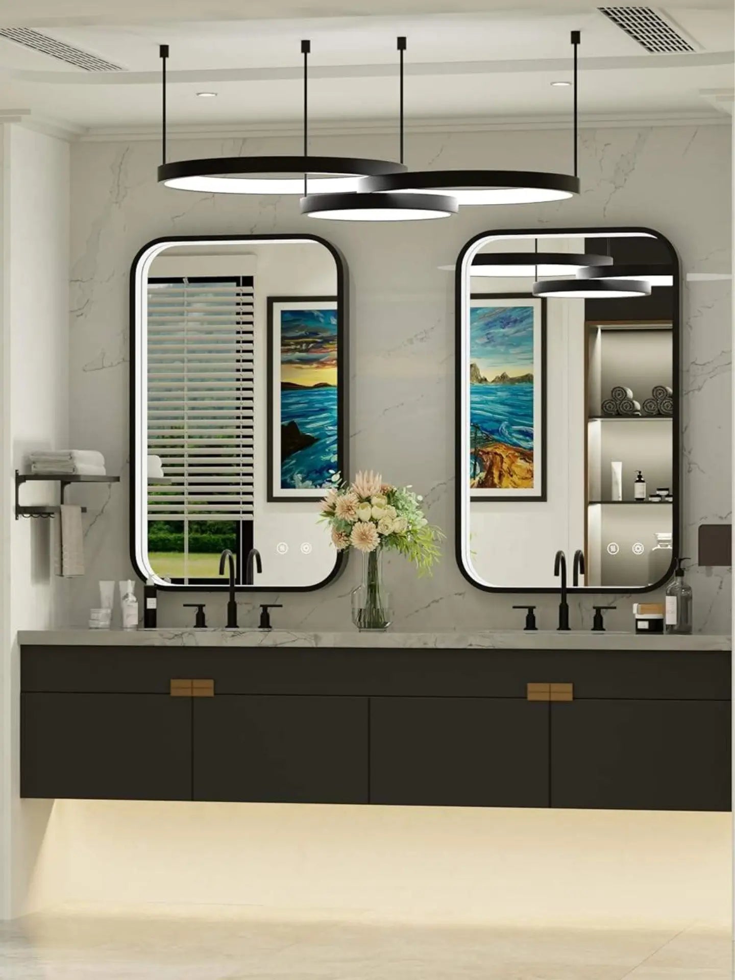 Bathroom vanity with two mirrors, lights, and a vase with flowers.